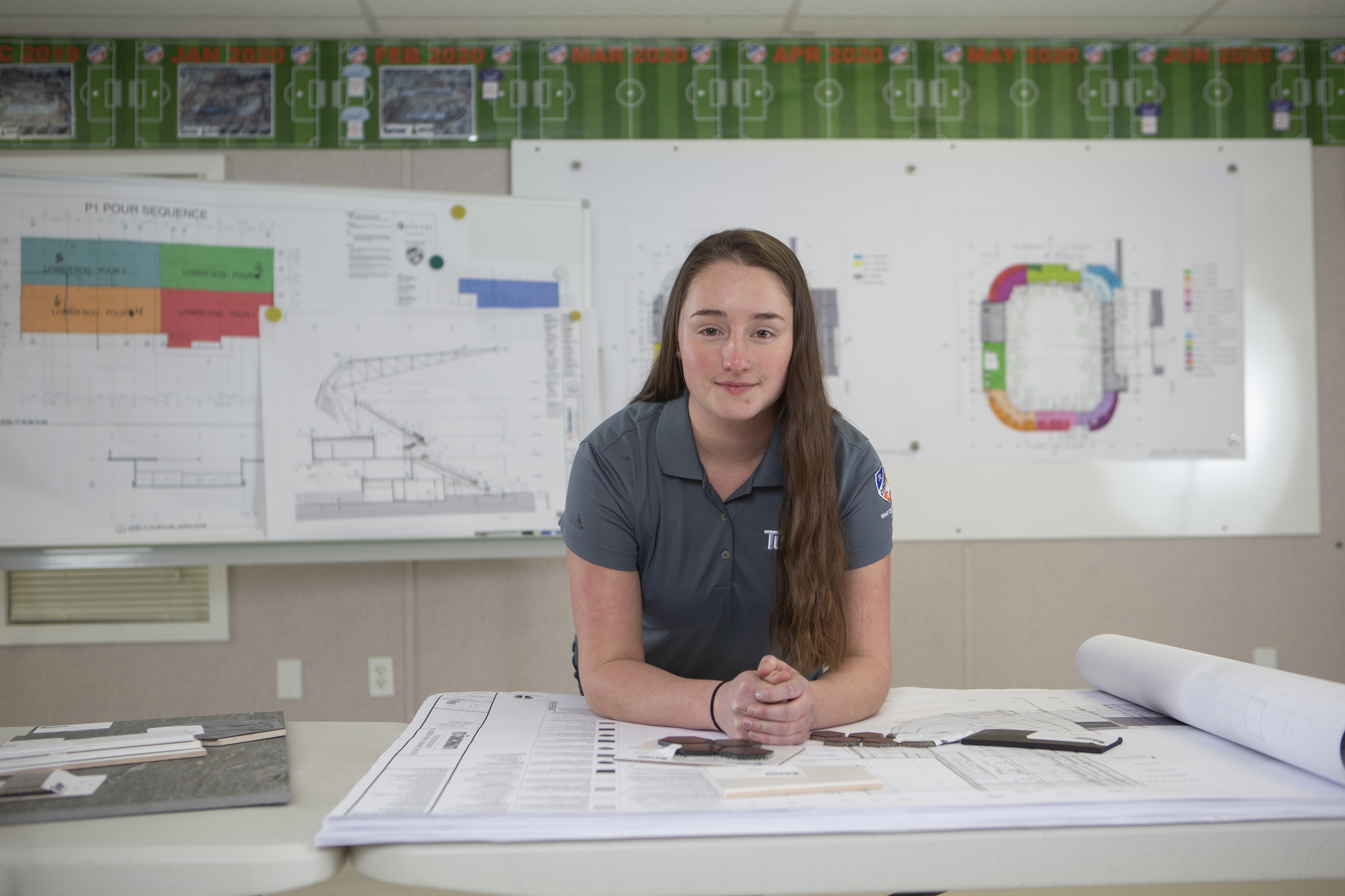 Person reviewing construction plans at a table