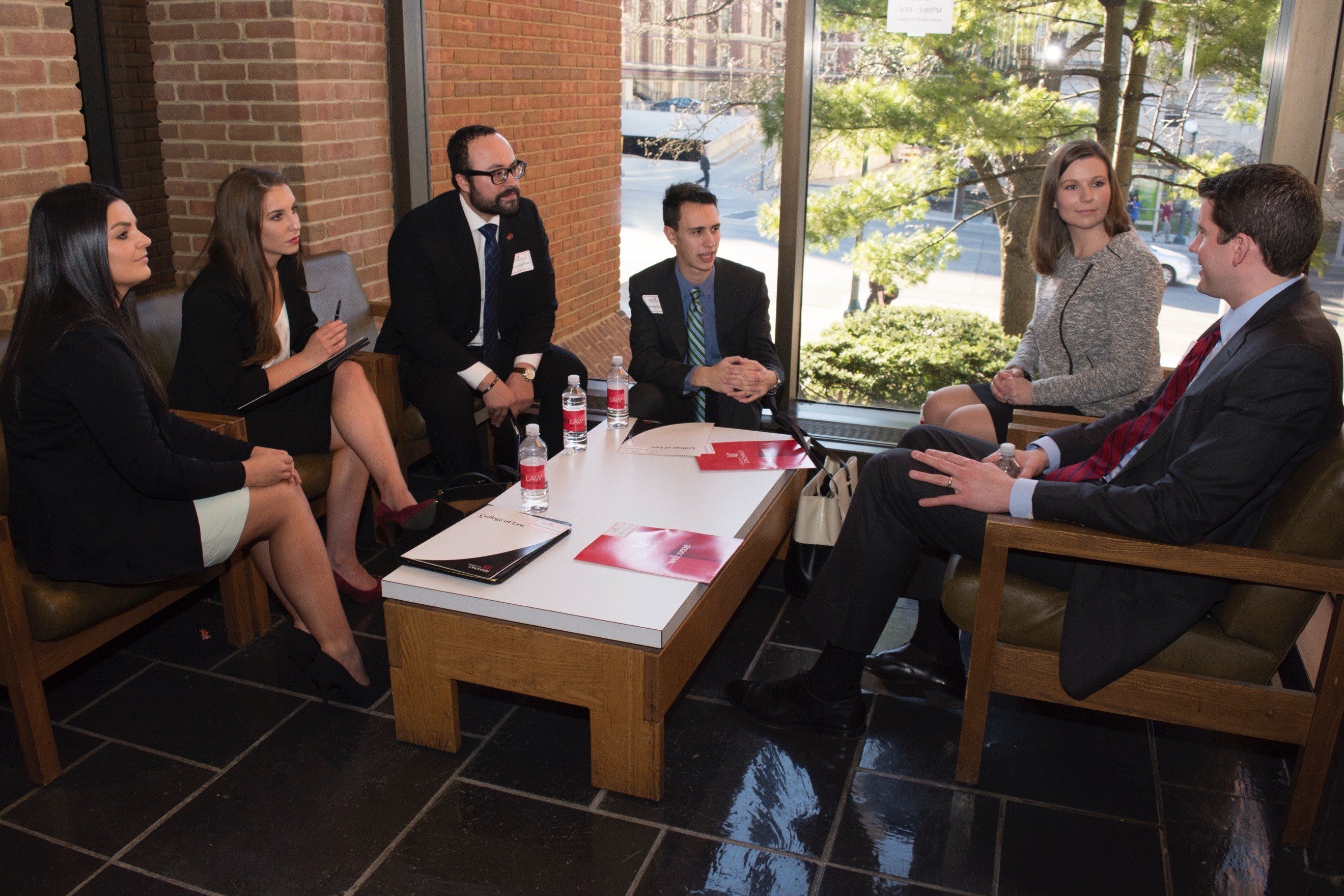 Group in business attire meeting around a table